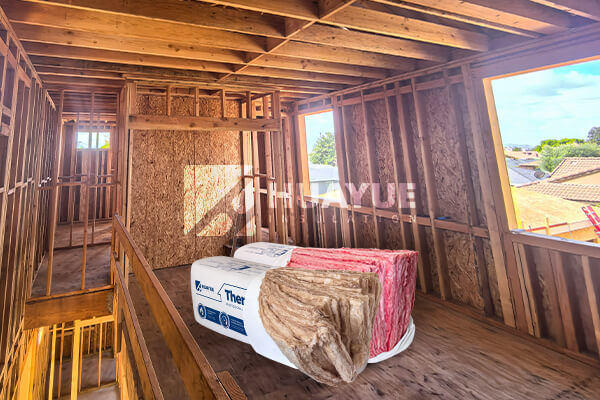 A clean, professional shot of fiberglass insulation rolls ready for installation