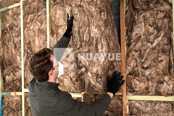 installation of glass wool in walls