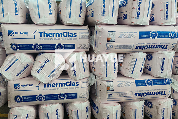 Fiberglass wool rolls in warehouse, ready for delivery