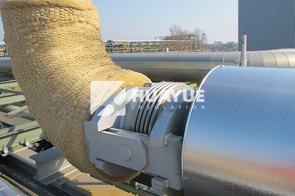 Rock wool insulation application on industrial tanks