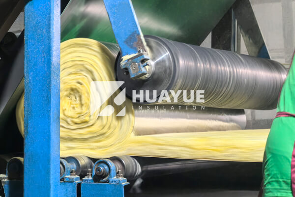 fiberglass insulation stacked in manufacturing plant