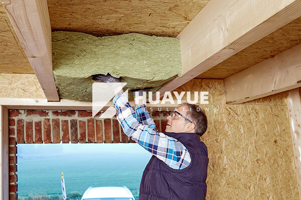 installing rockwool in a ceiling photo