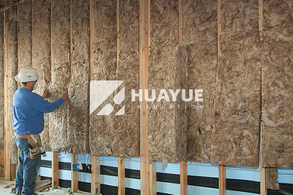 Installation process of batt insulation in wall cavity