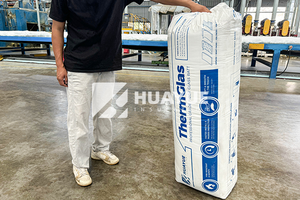 fiberglass batt installation in warehouse photo