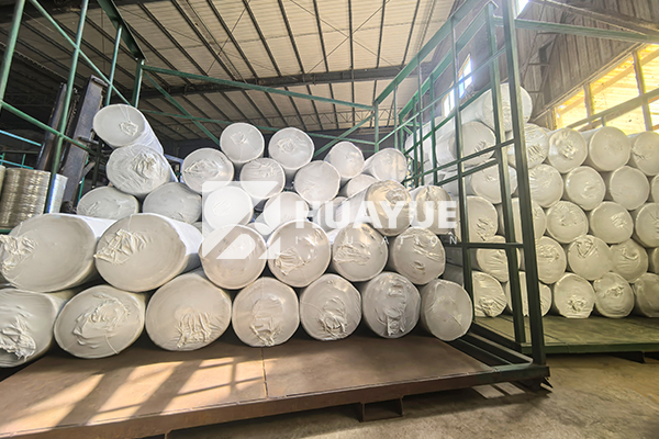 Installing rockwool slab on warehouse roof