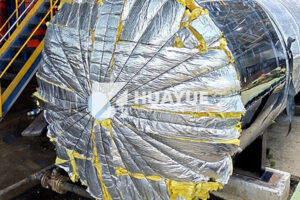 application of fiberglass insulation in an industrial tank