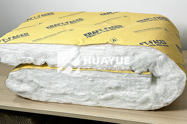 Faced fiberglass batt insulation product showing kraft vapor barrier