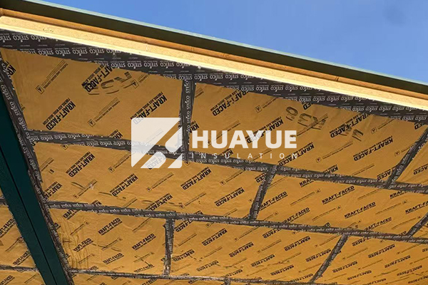 Insulation installation in residential attic showing proper application technique