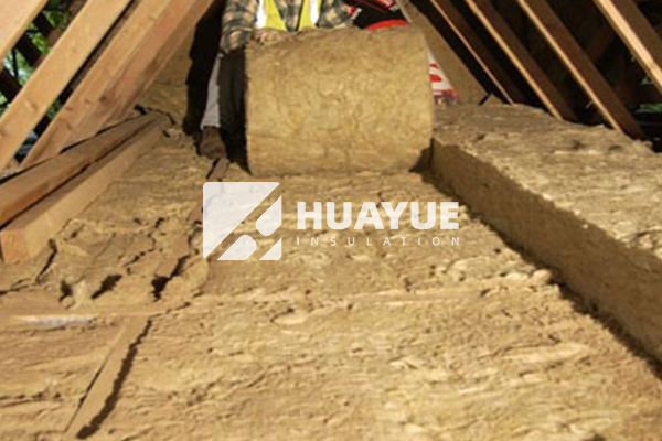 Attic being insulated with rock wool material