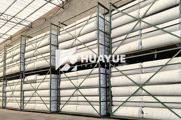 stone wool insulation product rolls in warehouse