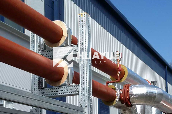 Rock wool pipe section, 24 inch, installed with aluminum cladding in outdoor chemical plant
