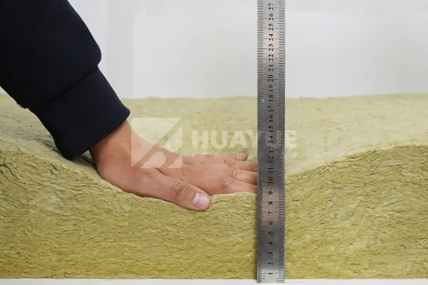 R30 mineral wool batt thickness measured with a tape