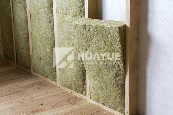 rock wool batt fitted tightly between timber floor joists